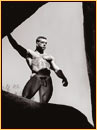 Jim French original gelatin silver print depicting a male nude standing on a rock formation